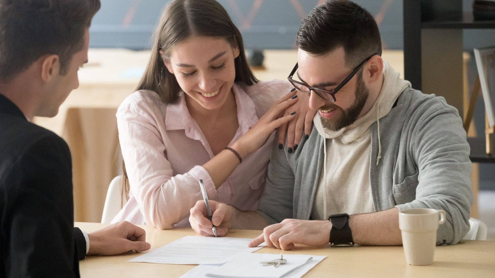 Happy Couple Signing Contract