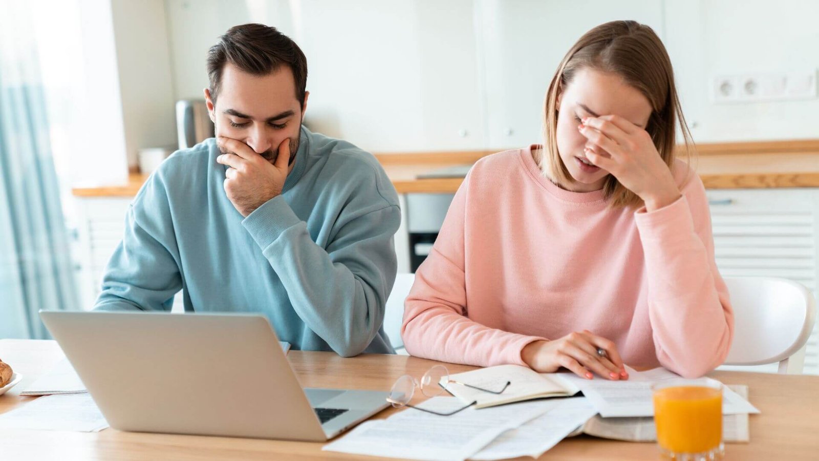 Stressed couple at table